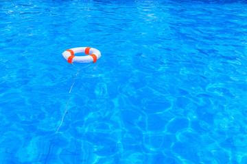 Life buoy floating in a swimming pool