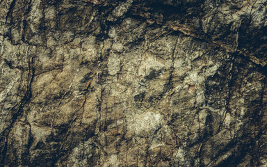 Close up texture of grunge cracked old stone wall.