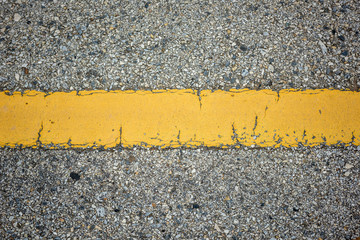 old asphalt texture with yellow line