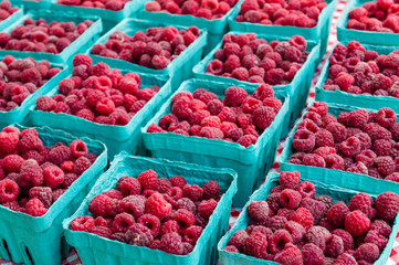 Ripe red raspberries at the market