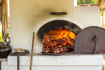 wood-burning stove with food in pots.