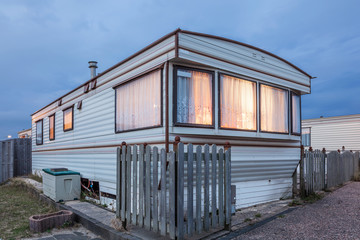 Mobile home on a trailer park at dusk