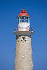 Lighthouse against clear blue sky