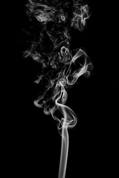 Abstract white smoke on black background.