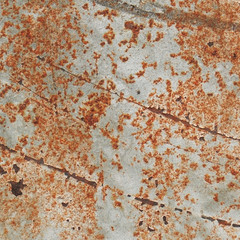 Old rusty metal plate with gray paint