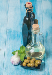 Olive oil and olives in bowl