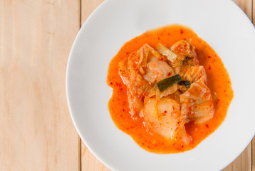 Kimchi salad of korean food traditional on wood table