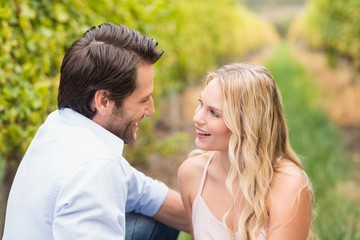 Young happy couple smiling at each other