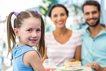 Portrait of a family eating at the restaurant