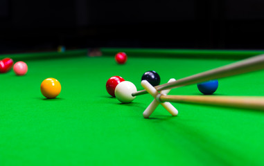 Snooker player placing the cue ball for a shot