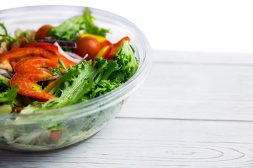 Healthy bowl of salad on table