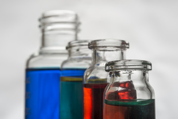 Set of laboratory bottles with color liquid