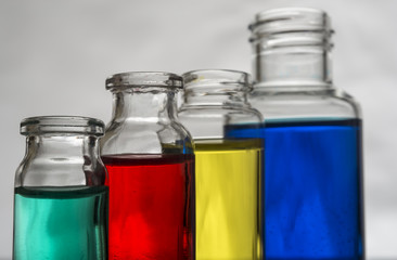 Set of laboratory bottles with color liquid