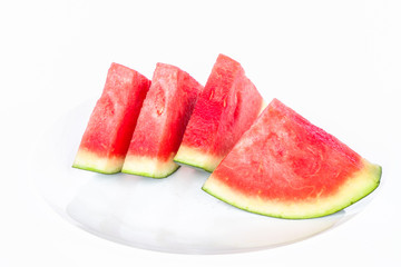 Watermelon slices on white plate isolate on white