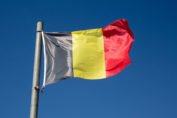 Belgium flag under blue sky