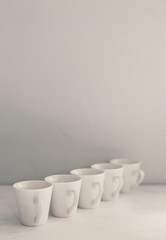 Fototapeta na wymiar Vintage photo of white cups