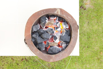 Stock Photo:.burning charcoal in old stove