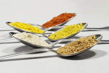 Several spoons with different kinds of spices
