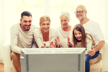 happy family watching tv at home