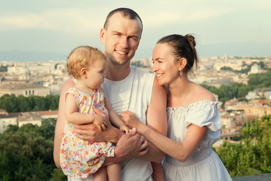 Portrait of happy family on background of city,