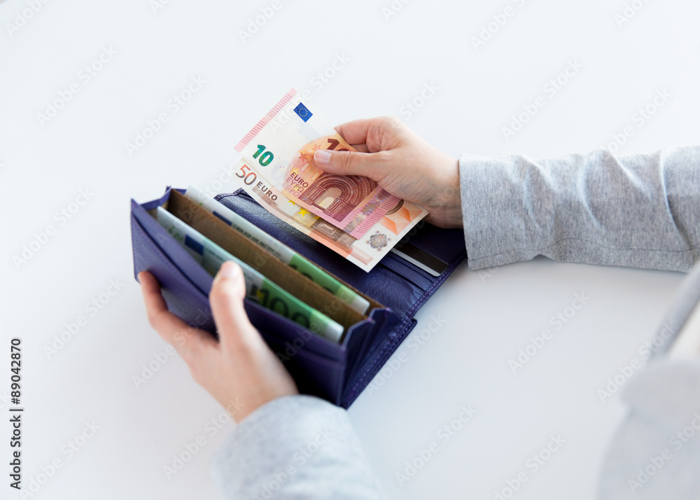 Poster close up of woman hands with wallet and euro money