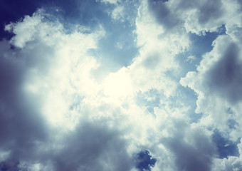 Obraz premium Vintage filter ; Nice blue sky with sun beam with cloudy