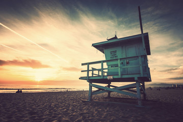 Naklejka premium Venice beach, sunset. Lifeguard stand. Vacation, summer, travel, nature and life style concept. Vintage colors post processed.