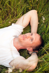 Man lying in   grass