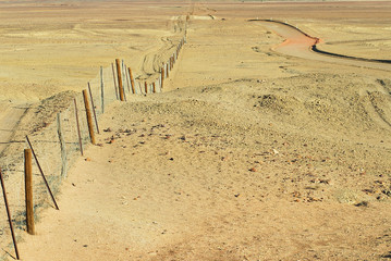 Dingoe fence in the Australian Outback. The fence is 9600 kilometers long, it keeps the dingoe dogs out of the areas, where the sheep graze.