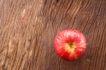 Apple on old wooden floor