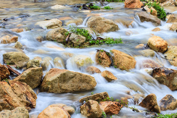Fototapeta na wymiar waterfall and rocks covered with moss