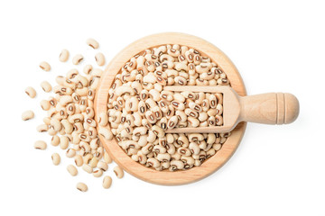 uncooked black eyed peas in plate, top view