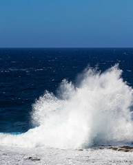 Ocean waves and surf in sunlight