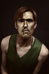 Studio portrait of young  men with gold makeup