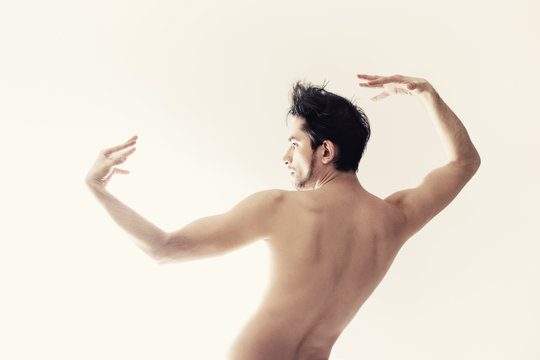 Young naked dancing man