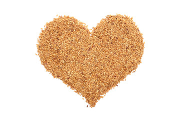 Golden linseed in a heart shape