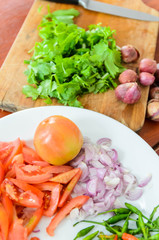 Tomatoes,onion,coriander sliced for cooking