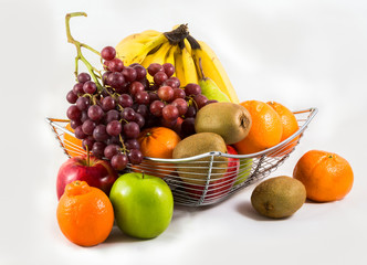 Composition with assorted fruits in  basket isolated on white