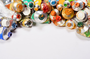 Professional acrylics paints in tubes on a white background.