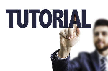 Business man pointing the text: Tutorial