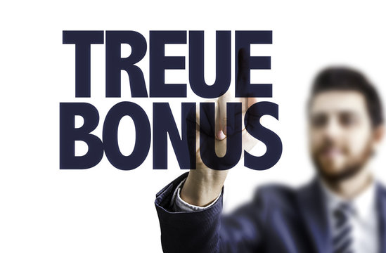 Business man pointing the text: Loyalty Bonus (in German)
