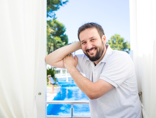 Man relaxing in summer vacation luxury resort