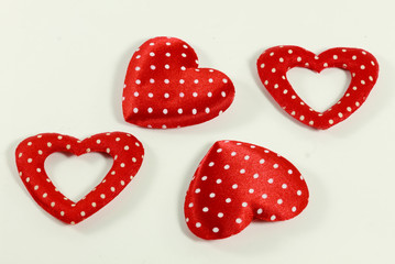 The red hearts on the white background.