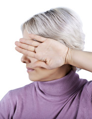 Fototapeta premium I'm not looking. The woman closes her eyes turning away hand