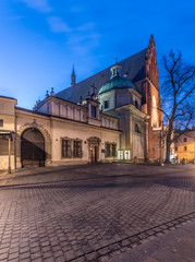 Krakow, Poland, main gate to the dominican monastery and gothic church of Holy Trinity, seen from Stolarska street in the morning.