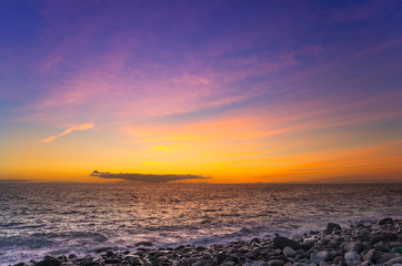 Fototapeta premium Sunset over the coast of Atlantic ocean