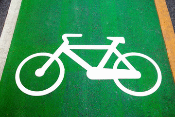 Bike lane signs painted onto a green bike lane (Bike lane, road © Pajjai