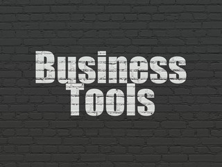 Finance concept: Business Tools on wall background