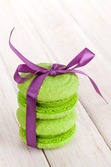 Green macarons with purple ribbon