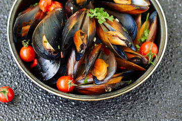 Cooked mussels with cherry tomatoes,top view